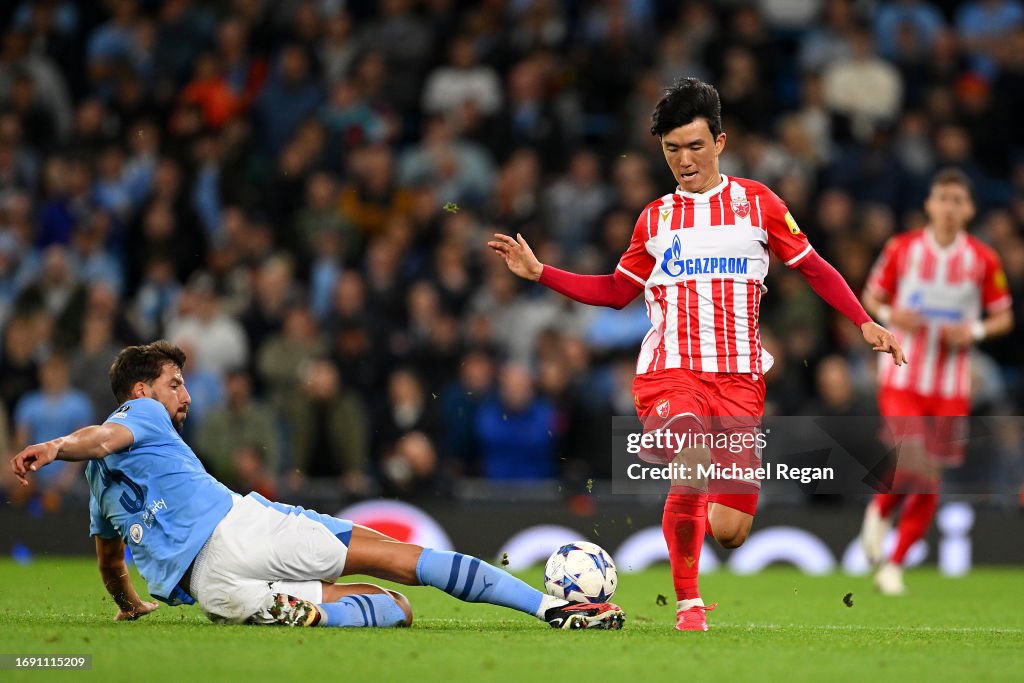 In-beom Hwang of FK Crvena zvezda is challenged by Ruben Dias of News  Photo - Getty Images