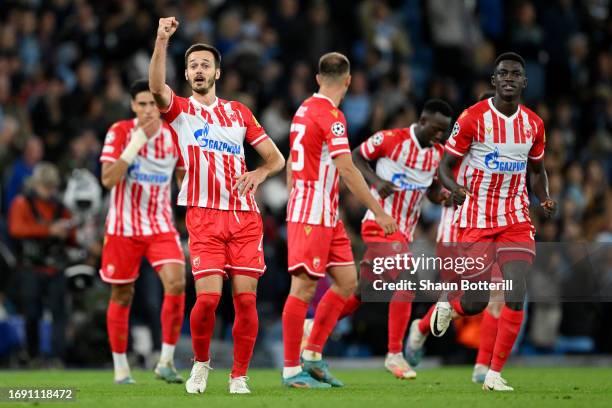 Mirko Ivanic of FK Crvena zvezda celebrates after teammate Osman Bukari scores the team's first goal during the UEFA Champions League Group G match...