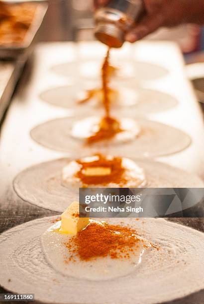 the making of traditional south indian butter dosa - thosai stock pictures, royalty-free photos & images
