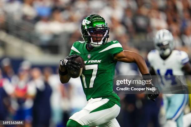 Garrett Wilson of the New York Jets runs the ball during a football game at AT&T Stadium on September 17, 2023 in Arlington, Texas.