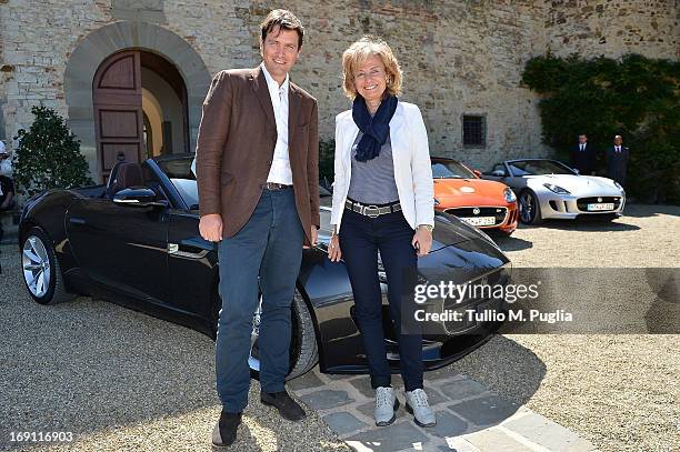 Salvatore Ferragamo Jr. Poses with Lidia Dainelli, Jaguar Land Rover Italy PR Manager , receiving a Jaguar F-Type during the Jaguar F-Type Event at...