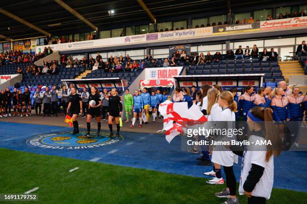 England captain Missy Bo Kearns leads out the England Women U23 team before the Women's International Friendly between England Women U23 and Belgium...