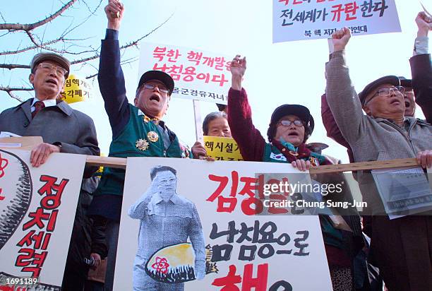 Protesters shout anti-North Korean slogans during a rally December 17, 2002 near the U.S. Embassy in Seoul, South Korea. More than 100 protesters...