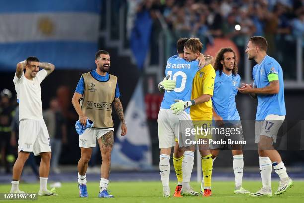 Ivan Provedel and Luis Alberto of Lazio celebrate victory at full-time following the UEFA Champions League Group E match between SS Lazio and...