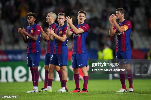Lamine Yamal, Oriol Romeu, Fermin Lopez, Gavi, and Sergi Roberto of Barcelona applaud the fans at full-time following the UEFA Champions League Group...
