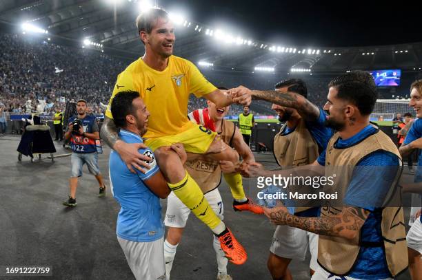 Ivan Provedel of SS Lazio goolkeeper celebrates after scoring the first goal with team mates during the UEFA Champions League match between SS Lazio...