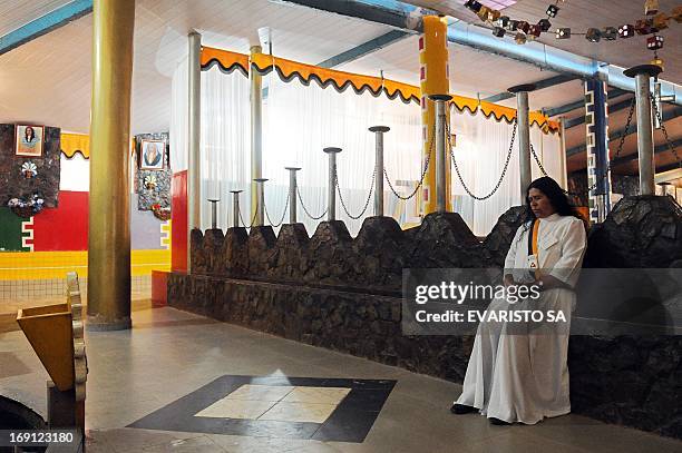 Faithful prays in a temple in Vale do Amanhecer , a mystical city four kilometres from Brasilia, on April 29, 2013. The Vale do Amanhecer is the...