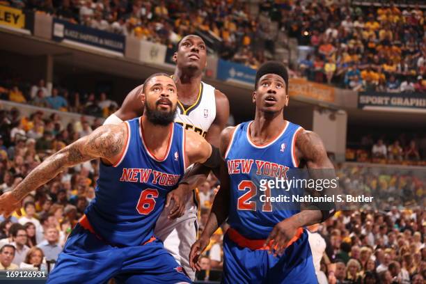 Tyson Chandler and Iman Shumpert of the New York Knicks box out Ian Mahinmi of the Indiana Pacers in Game Four of the Eastern Conference Semifinals...