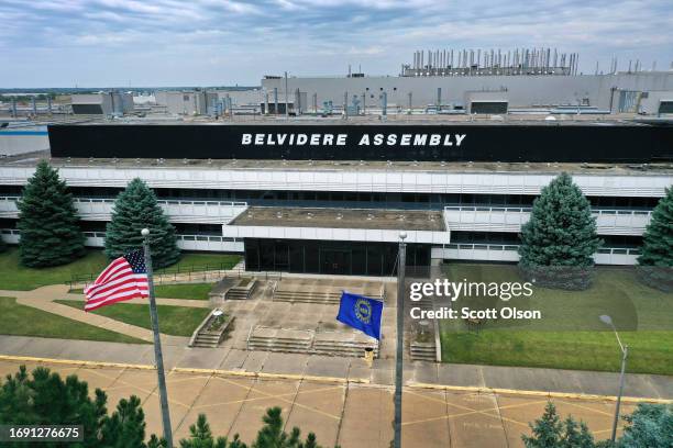 An aerial view shows and American flag flying next to a UAW flag outside of the Stellantis Belvidere Assembly Plant on September 19, 2023 in...
