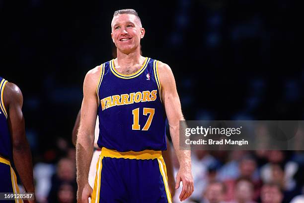 Chris Mullin of the Golden State Warriors smiles circa 1996 at the Oakland-Alameda County Coliseum Arena in Oakland, California. NOTE TO USER: User...
