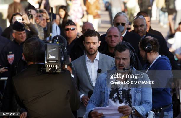 Actor and singer Justin Timberlake arrives on May 20, 2013 to take part in the show "Le Grand Journal" on the set of the French TV Canal+, on the...