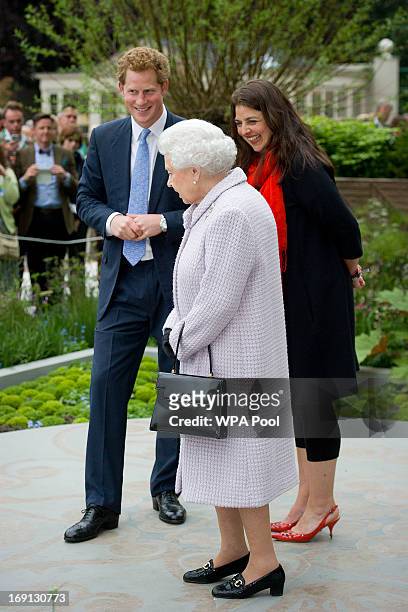 Queen Elizabeth II and Prince Harry visit the Sentebale Forget-me-not garden the Chelsea Flower Show press and VIP preview day at Royal Hospital...