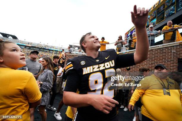 Place kicker Harrison Mevis of the Missouri Tigers celebrates with fans after kicking a game-winning filed goal against the Kansas State Wildcats at...