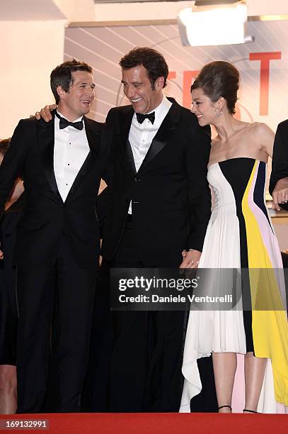 Clive Owen , director Guillaume Canet and actress Marion Cotillard leave the Premiere of 'Blood Ties' during the 66th Annual Cannes Film Festival at...