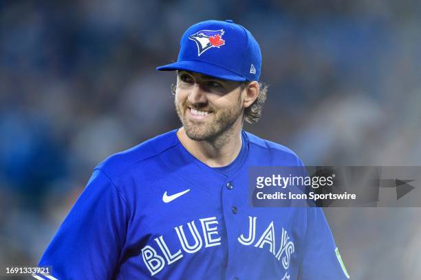 Toronto Blue Jays Pitcher Kevin Gausman smiles after an inning during the MLB baseball regular season game between the New York Yankees and the...