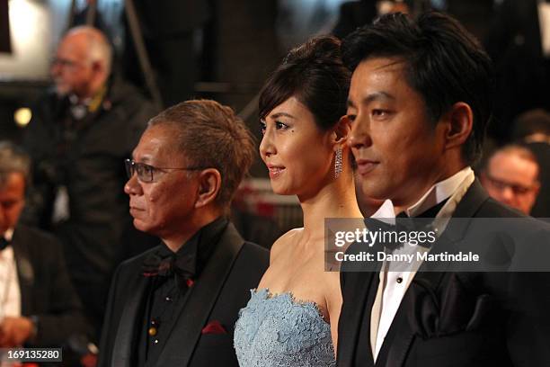 Takao Osawa, Nanako Matsushima, and Takashi Miike attend the Premiere of 'Wara No Tate' during the 66th Annual Cannes Film Festival at the Palais des...