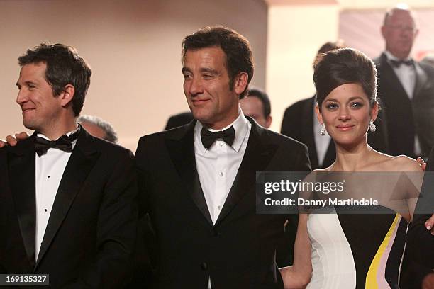 Actors Clive Owen, Marion Cotillard and James Caan leave the Premiere of 'Blood Ties' during the 66th Annual Cannes Film Festival at the Palais des...