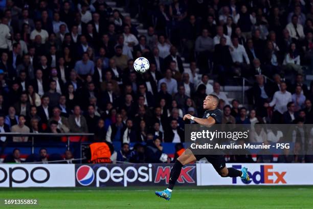 Kylian Mbappe of Paris Saint-Germain controls the ball during the UEFA Champions League match between Paris Saint-Germain and Borussia Dortmund at...