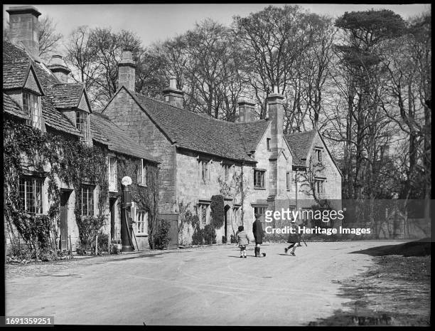 Stanway Road, Stanton, Tewkesbury, Gloucestershire, 1934. A view of houses at the northern end of Stanway Road with children playing in the road....