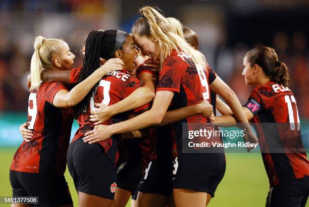 Jordyn Huitema of Canada celebrates a goal with Ashley Lawrence against Jamaica during a Paris 2024 Olympic Games Qualifier match at BMO Field on...