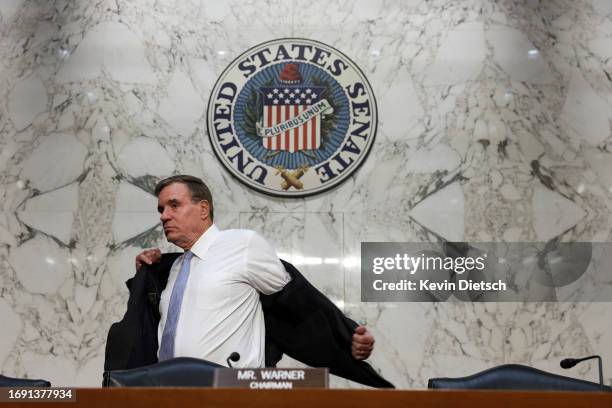 Senate Intelligence Committee Vice-Chair Mark Warner arrives for a hearing at the Hart Senate Office Building on September 19, 2023 in Washington,...