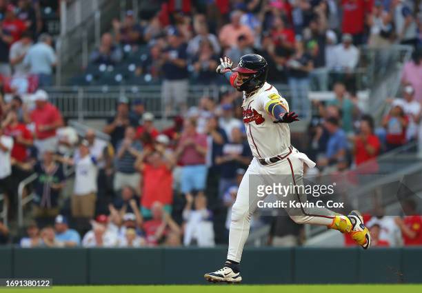 Ronald Acuna Jr. #13 of the Atlanta Braves reacts as he rounds first base after hitting a solo homer to lead off the first inning against the...