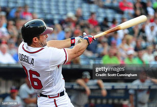 Dan Uggla of the Atlanta Braves hits a first inning three run home run against the Minnesota Twins at Turner Field on May 20, 2013 in Atlanta,...