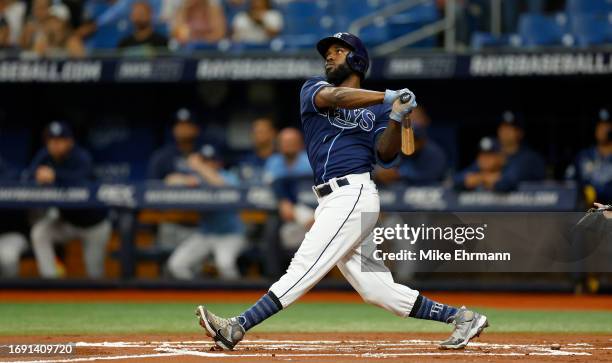 Randy Arozarena of the Tampa Bay Rays hits a two run home run in the first inning during a game against the Los Angeles Angels at Tropicana Field on...