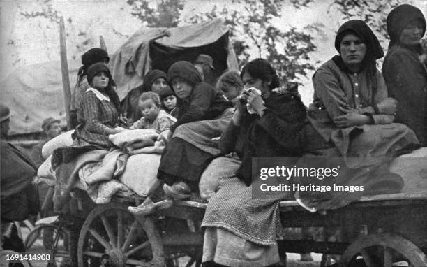 'The Dark Hours of Italy; Women and children of Friuli and Carnia fleeing the horrors of the invasion', 1917. From "L'Album de la Guerre 1914-1919,...