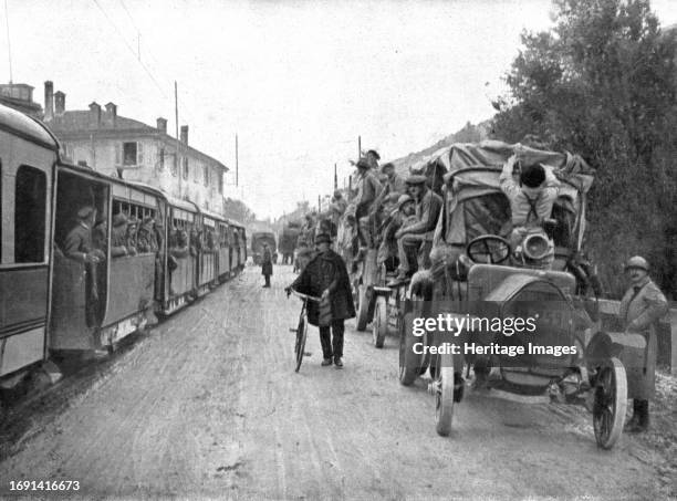 'French Troops in Italy; Two convoys on the road from Brescia to Verona: on the left, an electric train loaded with Italian troops; on the right,...