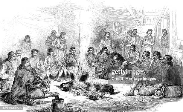 The War in the Herzegovina: Council of War at Peco Pavlovitch's Camp, from a sketch by our special artist, 1876. 'Crsto Pavlovitch; Bogdan Simonitch;...