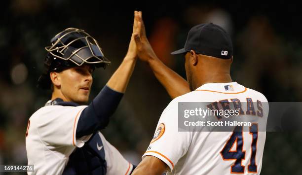 Jason Castro and Jose Veras of the Houston Astros celebrate at the mound after defeating the Kansas City Royals 6-5 at Minute Maid Park on May 20,...