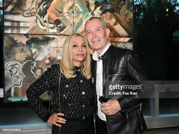 Nicole Salmasi and Jean Claude Jitrois attend the "Sacred Planet for #Art4GlobalGoals By Rita Sabo" Exhibition at UNESCO on September 19, 2023 in...