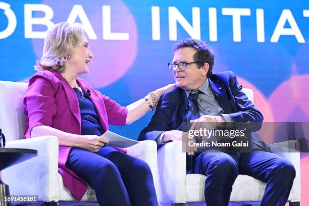 Former US Secretary of State Hillary Clinton and Michael J. Fox speak onstage during the Clinton Global Initiative September 2023 Meeting at New York...
