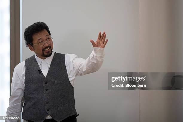 Takashi Murakami, a Japanese contemporary artist, gestures during an interview at the Galerie Perrotin in Hong Kong, China, on Monday, May 20, 2013....