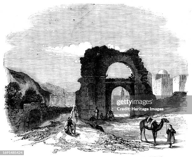 An Excursion from Tunis to Zowan - Roman and Saracen Entrance-Gate to Zowan, fifty miles south from Carthage, 1858. Engraving from a sketch by Mr....