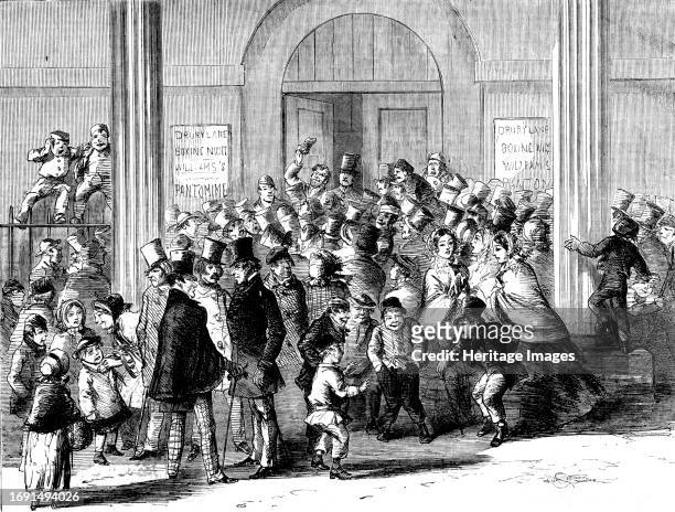 Drury-Lane Theatre - Engaging for the Pantomime - drawn by M'Connell, 1858. '...a curious Scene at the stage-door...every available place was...