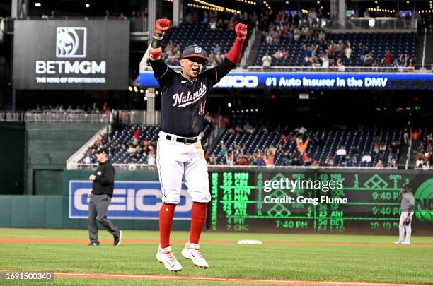 Ildemaro Vargas of the Washington Nationals celebrates after Joey Meneses hits a three-run home run in the seventh inning against the Chicago White...