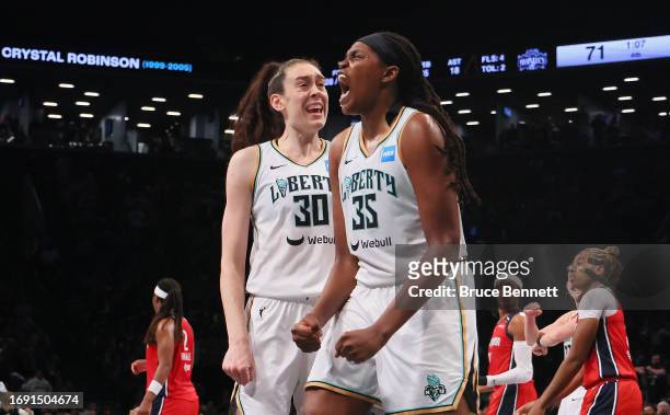 Breanna Stewart and Jonquel Jones of the New York Liberty celebrate a block against the Washington Mystics during Game Two of Round One of the 2023...