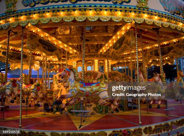 Fairground carousel ride with horses and no people, Weymouth, Dorset, England.