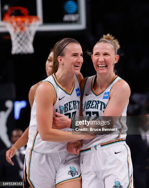 Sabrina Ionescu celebrates a three-pointer by Courtney Vandersloot of the New York Liberty in overtime against the Washington Mystics during Game Two...