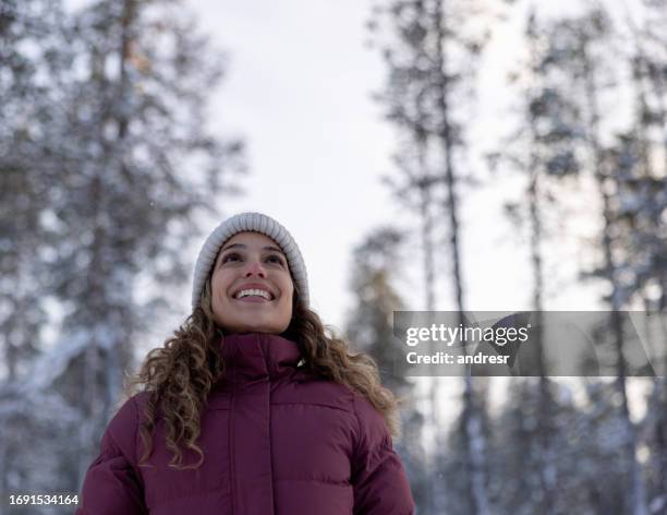 happy woman outdoors enjoying the winter in finland - the natural world stock pictures, royalty-free photos & images