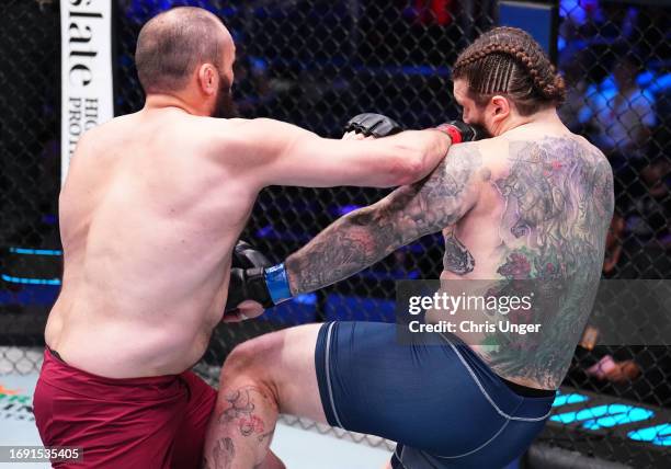 Shamil Gaziev of Russia punches Greg Velasco in a heavyweight fight during Dana White's Contender Series season seven, week seven at UFC APEX on...