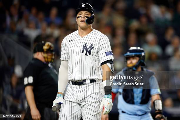 Aaron Judge of the New York Yankees reacts after striking out during the sixth inning against the Toronto Blue Jays at Yankee Stadium on September...