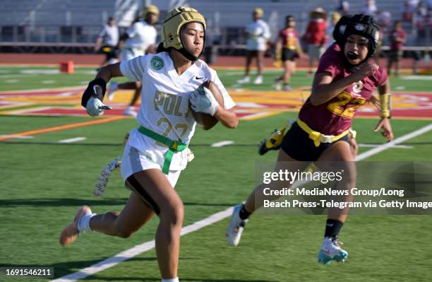 Long Beach, CA Polys Sydney Santos running the ball during a flag football game against Wilson in Long Beach on Tuesday, September 19, 2023. Final...