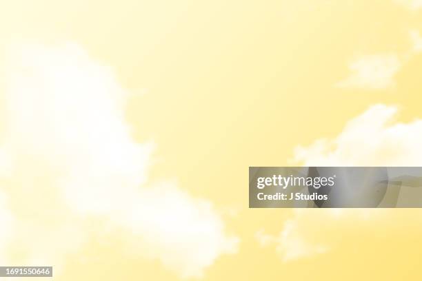 abstract yellow sky with soft white clouds - sfondo giallo foto e immagini stock
