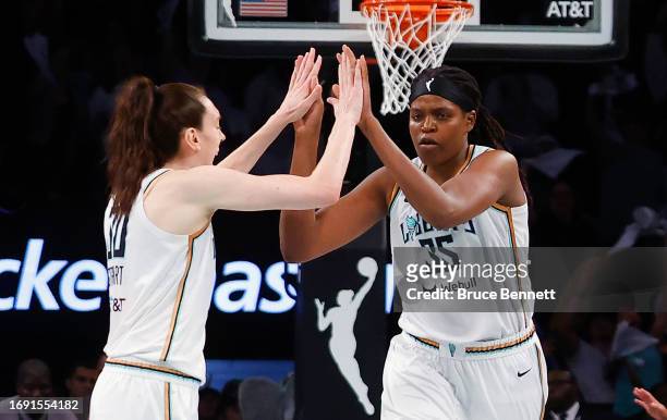 Breanna Stewart celebrates a basket by Jonquel Jones of the New York Liberty against the Washington Mystics during Game Two of Round One of the 2023...