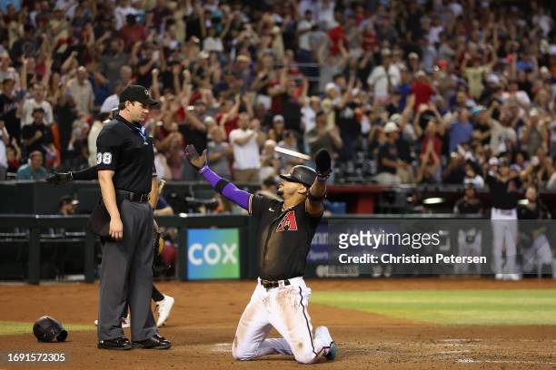 Ketel Marte of the Arizona Diamondbacks reacts after scoring a run on an error during the second inning of the MLB game against the San Francisco...