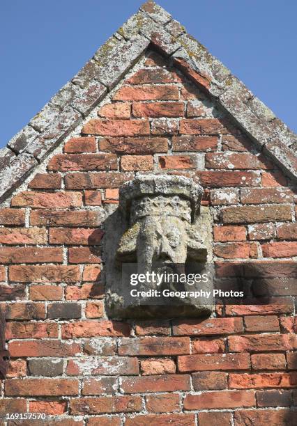 Weathering of medieval limestone carving suggesting effects of acid rain and carbonic acid, Covehithe church, Suffolk, England.