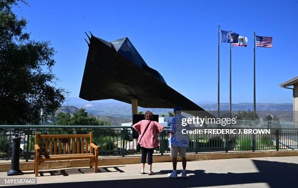 People view the F-117A Stealth Aircraft on display at the Ronald Reagan Presidential Library on the eve of the second Republican presidential primary...